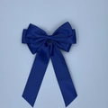 Macro shot of high-quality navy blue satin ribbon bow with elegant long hanging streamers - Navy Blue