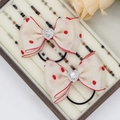 Pair of cream red polka dot chiffon bow hair ties with heart shaped crystal accents - Heart Rhinestone Hair Ties (05#)