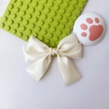 Minimalist creamy white satin bow hair clip with a smooth silk finish and double-layered design - Beige