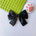 Elegant black satin double-layered bow hair clip on a clean decorative background - Black
