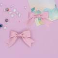Detailed view of pink satin ribbon bow hair clips with soft silk texture and center knot - 2-Piece Set / Pink (Korean Style)