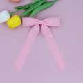 Detailed view of pink lace layered bow hairpin with delicate floral mesh and V-cut ribbon - Pink