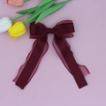 Detail of burgundy mesh and satin hair clip with elegant double-layered bow design - Burgundy