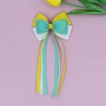 Detailed close-up of tricolor ribbed ribbon bow hairclip with long streamers for girls - Yellow, Green and White Color Block