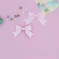 Paire de jolies barrettes à cheveux rose avec nœud en gros-grain pour filles sur fond rose - Ensemble de 2 Pièces / Rose Sakura