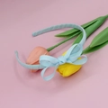 Detailed view of light blue grosgrain ribbon bow headband on soft pink background - Light Blue
