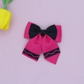 Detailed view of pink and black grosgrain ribbon hair bow with wavy crayon pattern - Rose Red