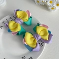 Detail of colorful layered grosgrain bow hair clips on a decorative ceramic plate - Vivid Pink Blue Style (03)