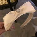 Diadema francesa de satén crema con lazo doble grande y cristal de corazón - Blanco Roto