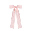 Detailed view of pink lace bow hair clip with elegant floral embroidery and long ribbons - Pink