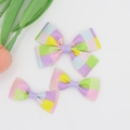 Detailed top view of three-piece grosgrain ribbon bow clips with colorful plaid patterns - 06# Macaron Patchwork