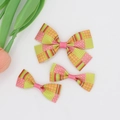 Close-up of three pieces grosgrain ribbon bow hair clips with floral and plaid patterns - 07# Pastoral Floral Patchwork