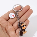 Cartoon dachshund metal keychain with I Love Dogs heart tag held in hand - Brown Waving Dachshund With Heart