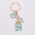 Portachiavi fiore di ciliegio blu e oro con pesce koi e ciondolo portafortuna - Blu Tutto Va Bene (蓝色万事胜意)