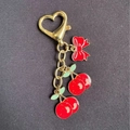 Pastoral cherry keychain with red enamel bow and golden heart-shaped lobster clasp - Cherry Bowknot Style