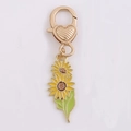 Porte-clés tournesol doré avec fermoir coeur et pétales en émail jaune brillant - Tournesol de Face