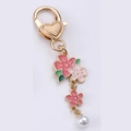 Pink enamel flower keychain with gold heart clasp and white pearl charm accessory - Sakura Pearl String