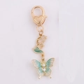 Golden butterfly keychain with mint green enamel, faux pearl and heart-shaped lobster clasp - Ancient Style Butterfly