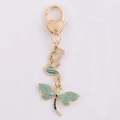 Golden dragonfly lily of the valley keychain with teal enamel wings and heart clasp - Ancient Dragonfly