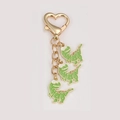 Cartoon green dinosaur keychain with gold heart clasp and three colorful charms - Green Dinosaur