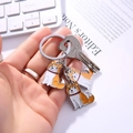 Porte-clés mignon Shiba Inu et Corgi en alliage avec anneau en métal argenté poli et breloques - Bague à Triple Breloque Chien Orange