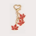 Golden heart clasp keychain with three vibrant red enamel maple leaf pendants - Red Maple Leaves