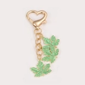 Golden heart-shaped keychain with three vibrant green maple leaf charms in enamel - Green Maple Leaf