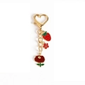 Golden heart-shaped keychain with red enamel strawberry and floral charms pendant - Style 02 Strawberry