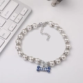 Elegant pearl pet necklace with bone charm and blue rhinestones for cats and dogs - M 25cm 18 Beads / Blue Rhinestone Bone