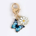Porte-clés papillon bleu avec fermoir coeur doré et pendentif fleur de marguerite - Papillon Bleu Blanc