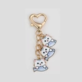 Cute golden heart keychain featuring three white and blue cartoon cats catching fish charms - White Cat Fish