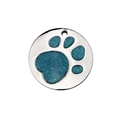 Close-up of circular zinc alloy pet tag with hollow paw print and sparkling teal inlay - Light Blue