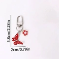 Red butterfly keychain with white polka dots, floral charm, and sparkling rhinestones - Red Dotted Butterfly