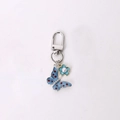 Blue butterfly keychain with enamel flower and pearl detail on silver metal lobster clasp - Blue Dotted Butterfly
