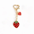 Golden strawberry keychain with red heart pendant and enamel fruit charm detail - 03 Strawberry