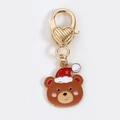Porte-clés de Noël ours brun avec bonnet rouge et fermoir cœur doré - Ours de Noël