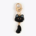 Creative black cat keychain with golden heart lobster clasp and swinging tail pendant - Black Cat