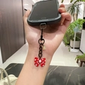 Polka dot red bow phone charm with a golden Good Luck tag and black metal chain - Red Bow