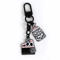 Gothic Halloween keychain set with skull jar and bone hand clapperboard in black enamel - Skull Bottle and Clapperboard Combo