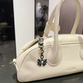 Creamy white leather Boston bag with black polka dot bow and Seoul logo branding - Black Bow