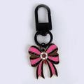 Pink and black striped bow keychain with eyeball center and black matte carabiner - Bow Pendant