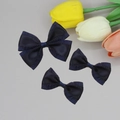 Detailed view of three navy blue pleated satin bows for elegant hair accessories - Navy Blue
