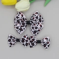 Detailed view of pink leopard print ribbon hair bows with black knot on gray background - Pink Leopard Style (06#)