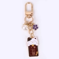 Golden Maneki-Neko lucky cat keychain with purple flower and white pearl pendant charm - May Everything Go As You Wish