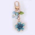 Fashionable blue flower metal keychain with pearl accent and gold-plated clasp accessory - Large Cherry Blossoms / Blue