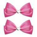 Detail view of two rose pink satin bow hair clips with heart-shaped pearl center - Rose Red