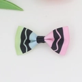 Detail of candy-colored grosgrain ribbon bow hair clip with wavy black stripes - Light Multi-color