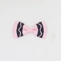 Detailed macro view of pink and navy striped grosgrain ribbon texture on handmade bow clips - Pink