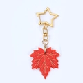 Porte-clés feuille d'érable en acrylique rouge brillant avec boucle étoile dorée de sac - Feuilles d'Érable Rouges