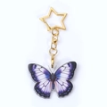 Porte-clés papillon en acrylique avec fermoir étoile dorée pour sacs de luxe - Papillon Violet